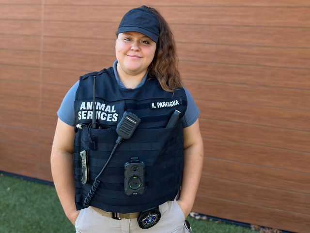 Kaylee Paniagua stands in front of animal services building