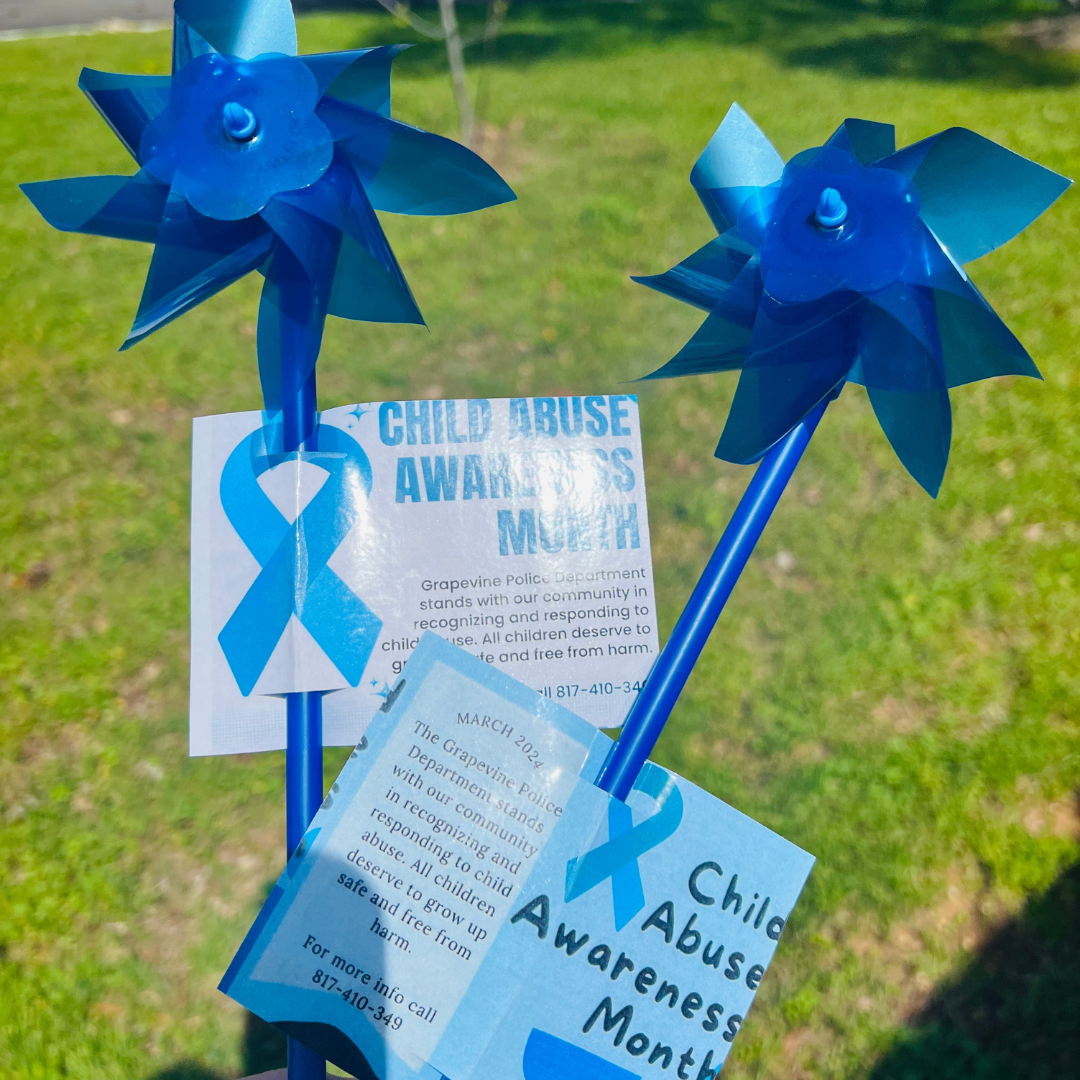 pinwheel with paper text: child abuse awareness